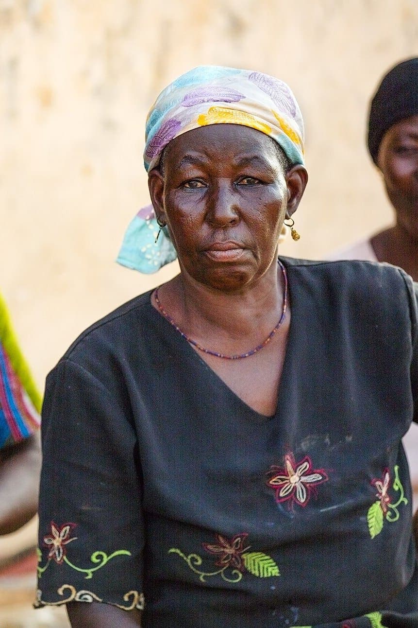 Portrait of a woman who works in shea butter processing.